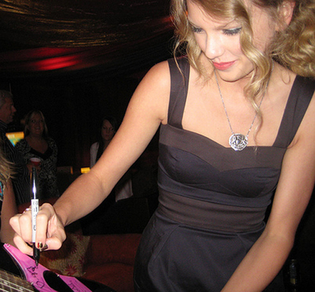 Taylor Swift wearing Pyrrha Two Eagles wax pendant